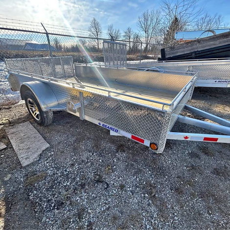 6x12 aluminum utility trailer with bi-fold gate, hardwood deck, LED lights, and 3,500 lb axle. Lightweight and ready for everyday hauling.