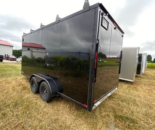 black enclosed trailer rear angle dual axle view