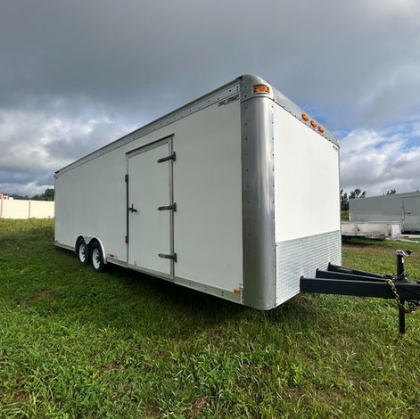 2007 refurbished 102 in x 20 ft car hauler trailer with 5,200 lb axles, a 2 5/16" ball coupler, ramp door, beavertail, fiberglass walls, pressure-treated flooring, finished ceiling, and a very solid frame with no rust issues. Yellow safety stickers are kept up to date.