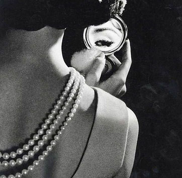 1920s black white pearls compact mirror grainy aesthetic.jpg