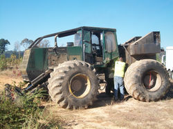 Skidder being fine tuned in the field