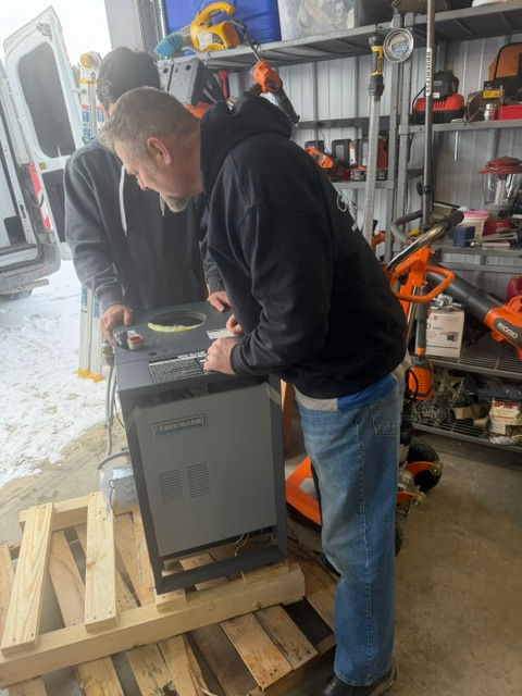 Apex Mechanical HVAC technicians preparing equipment for a service appointment