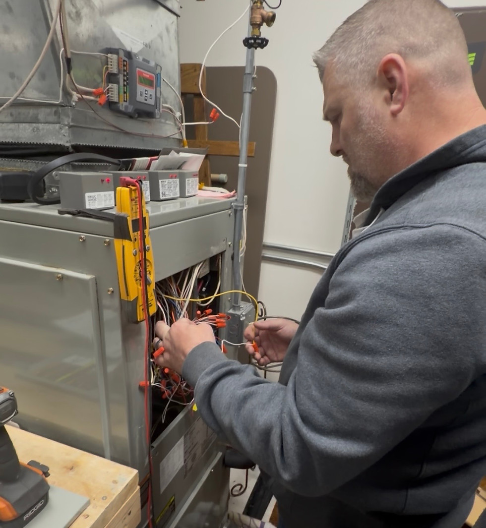 Apex Mechanical technician servicing a commercial furnace in Central Minnesota