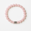 Thumbnail: Pink beaded bracelet with silver patterned spacer bead on white background.