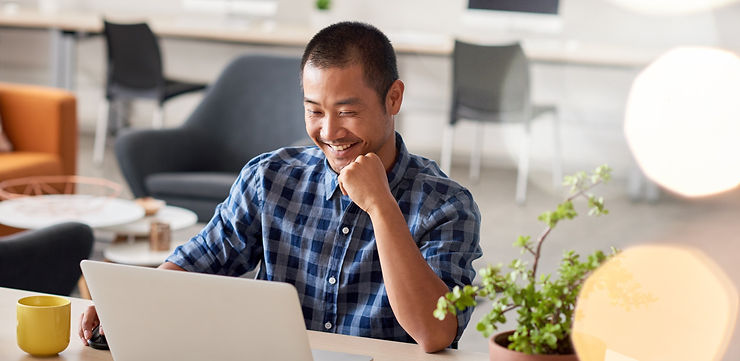 Young Asian designer smiling confidently