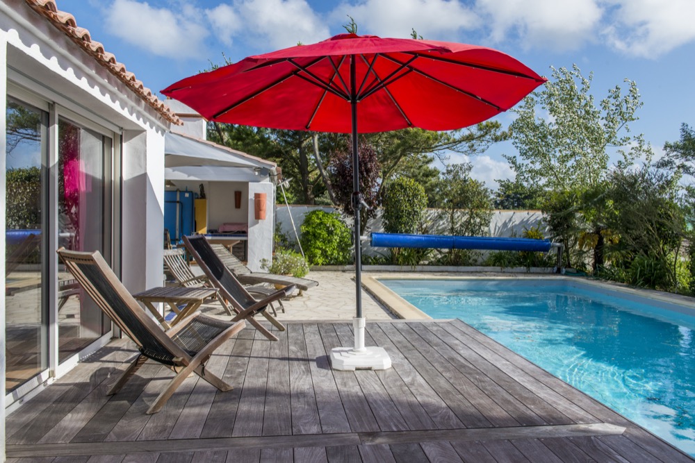 pool, hammock and beach umbrellas