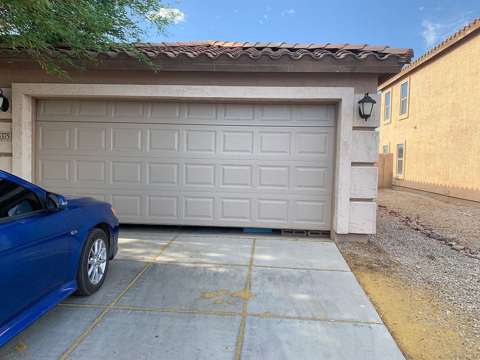 New sandstone residential garage door installation completed by Riggs Garage Door Service in the West Valley