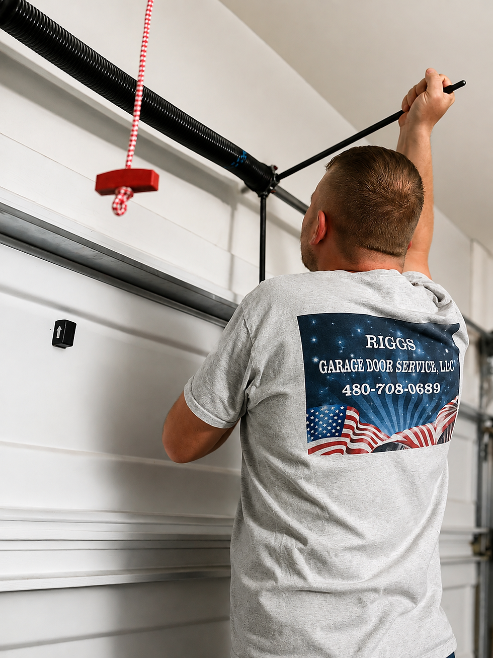 Riggs Garage Door Service technician replacing a residential garage door torsion spring