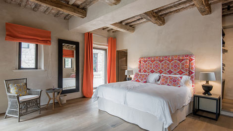 Master bedroom in a traditional stone villa in Umbria