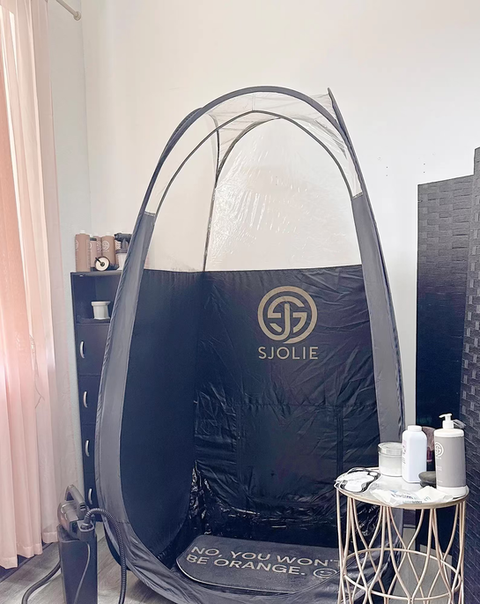 Sjolie spray tanning booth setup at Revive Spa & Lash Lounge in Southern Pines