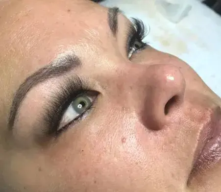 Close-up of brows and lash extensions Southern Pines, showcasing natural beauty enhancement.