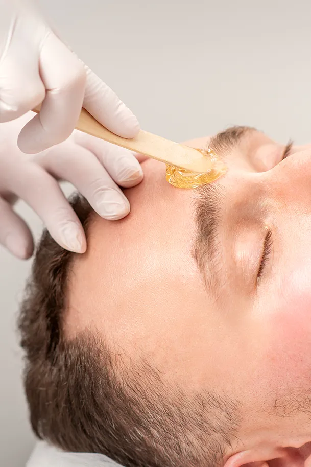 Eyebrow waxing service for men at Revive Spa & Lash Lounge, a trusted Southern Pines spa offering precise and gentle brow shaping.