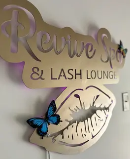 Revive Spa & Lash Lounge butterfly wall sign highlighting Southern Pines’ spa and lash services