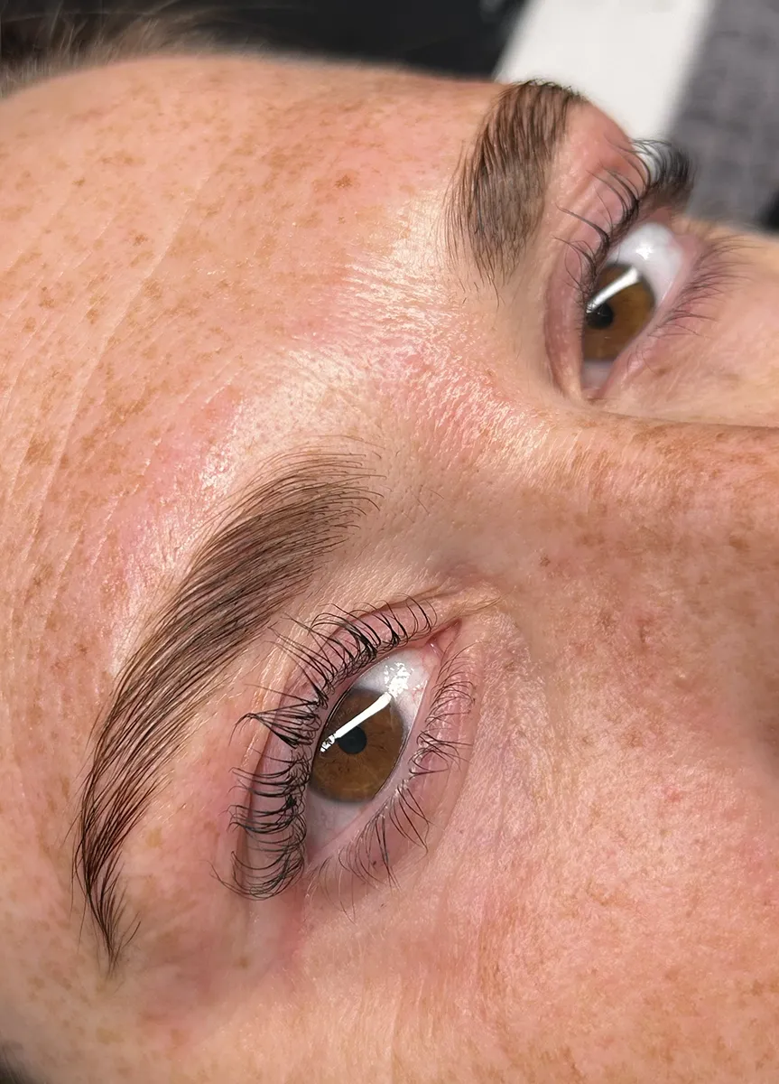 Client after brow lamination in Southern Pines with fuller, polished brows.