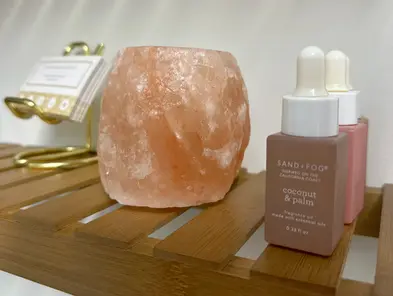 Tranquil spa decor with Himalayan salt lamp at Southern Pines' Revive Spa, creating a relaxing skincare experience