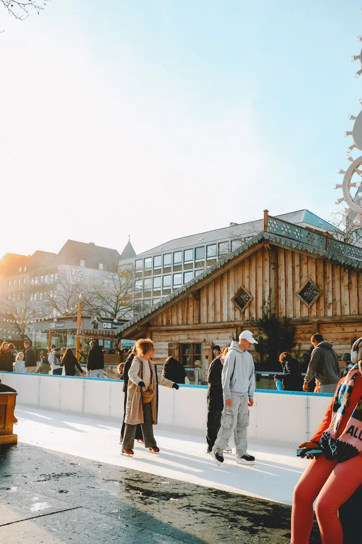 teens ice skating at Germany Christmas Markets