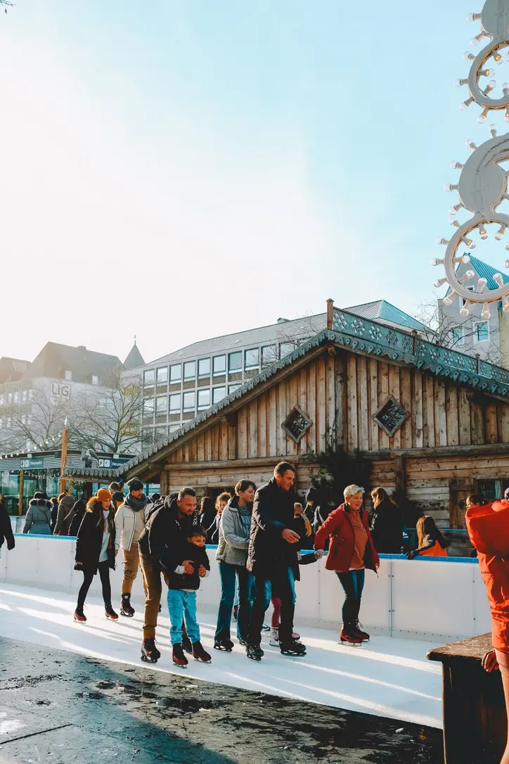 Ice skaters at cologne christmas market germany