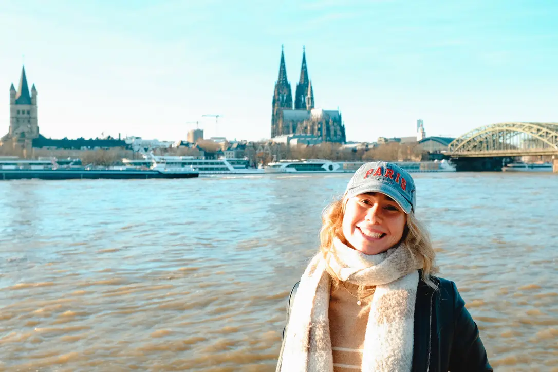 girl smiling with hamburg waterway in background