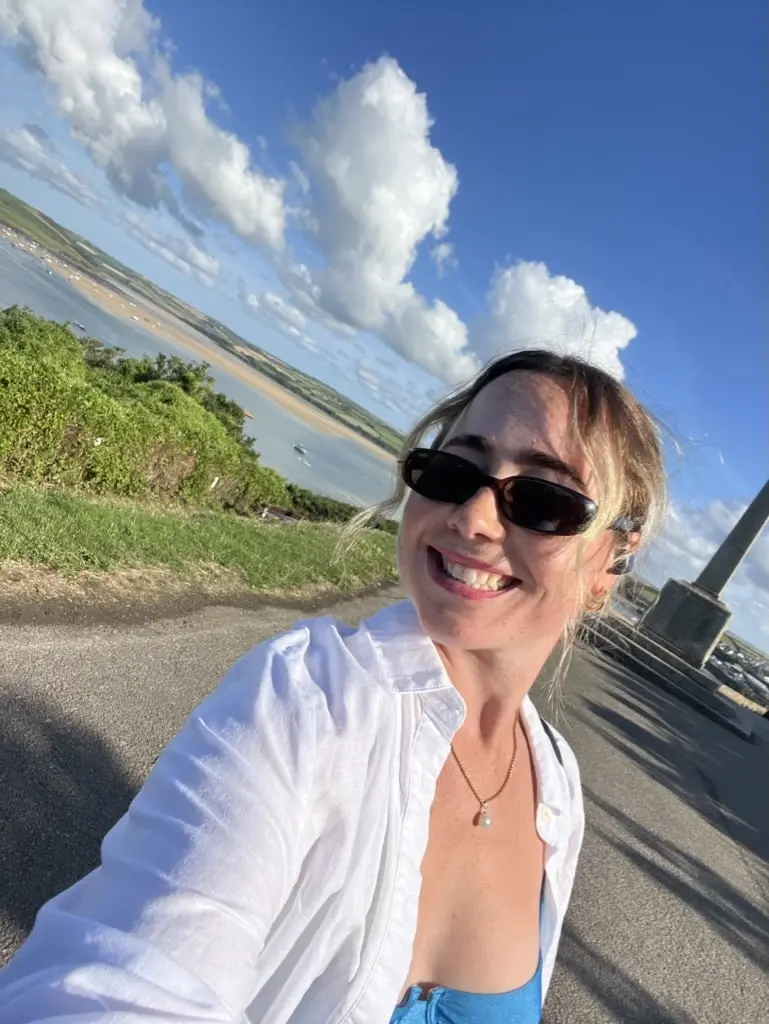 girl smiling in sunshine in padstow