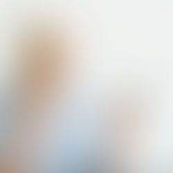 older woman looking worried at a suspicious message on her smartphone