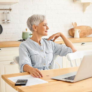 Retired woman reviewing information about benefits and services from home
