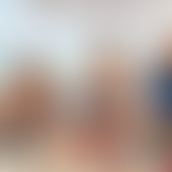 Older adults enjoying the beach while protecting their skin from the sun