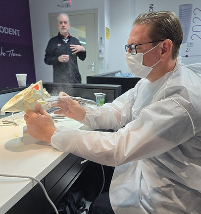 “Dr. Alan Martinez designing a custom dental treatment plan using a diagnostic model at Baja Dental Smile.”