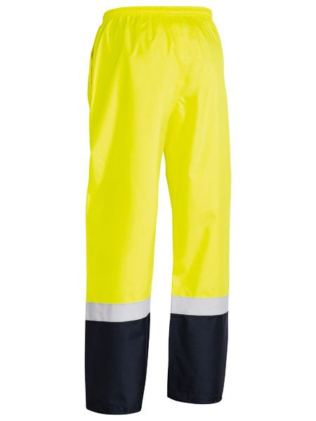 Thumbnail: High-visibility yellow work pants with reflective stripes