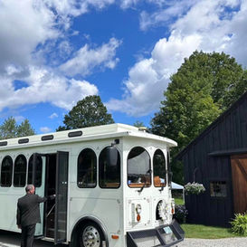 White trolley for guests in front of Barn 