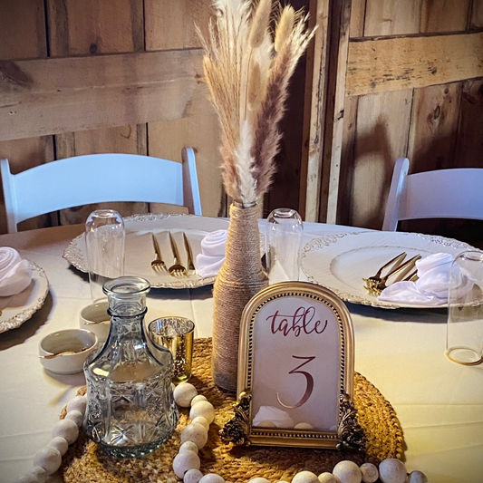 Table setting in barn for reception
