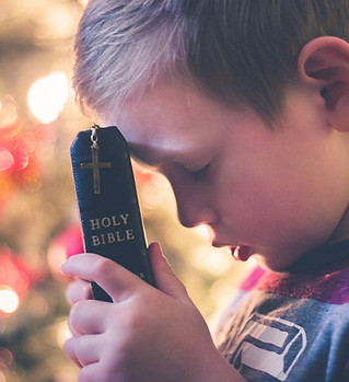 Child Holding Bible
