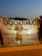 Photo of a Samos Protest Banner that reads "No to Isolation & Invisibility"