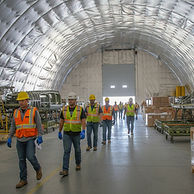 Large clear span tension fabric building interior ready for industrial or construction use