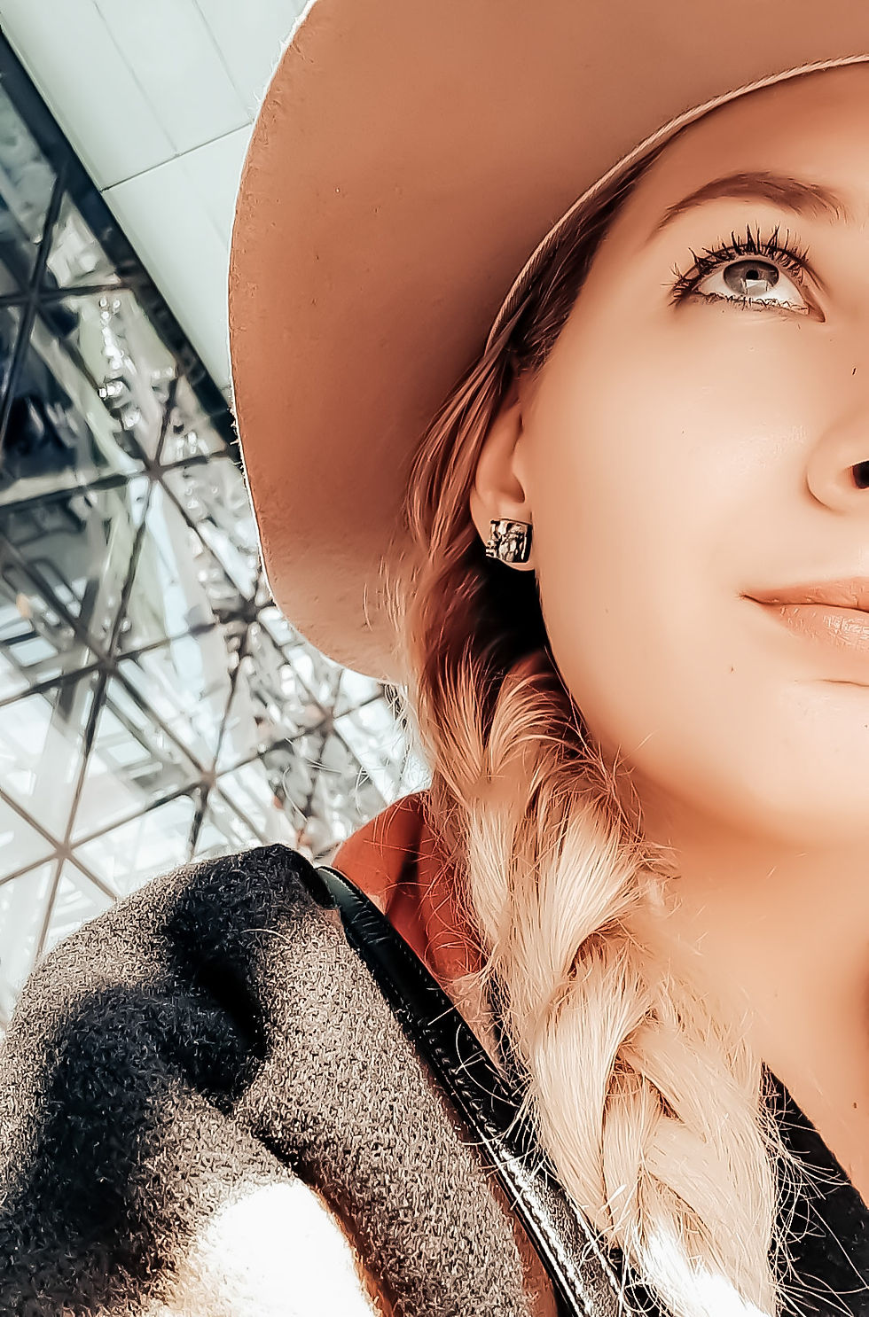 girl with the hat on and braids