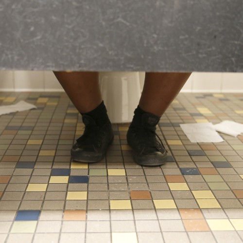 mens feet in the restroom