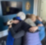 Photo of a group of women in a huddle. Sibylline Press authors.