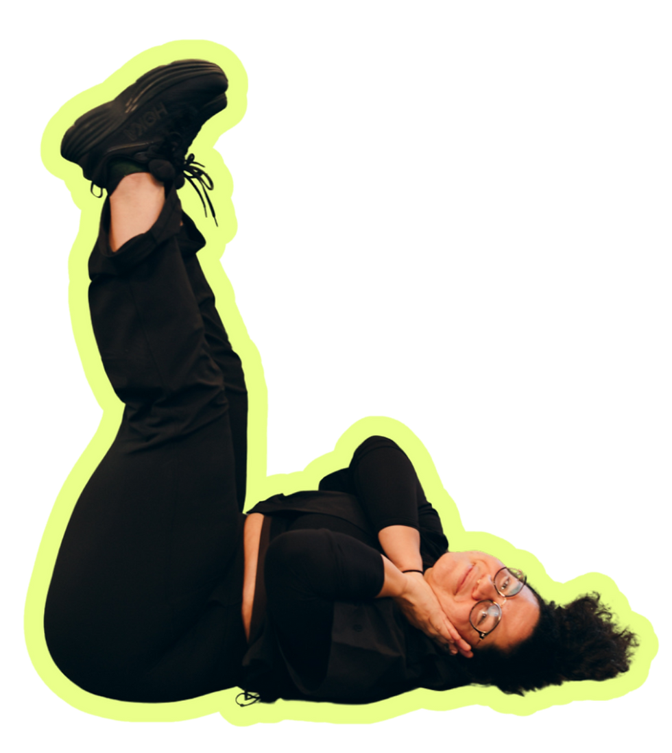 Cut out of woman laying on the ground with her feet up
