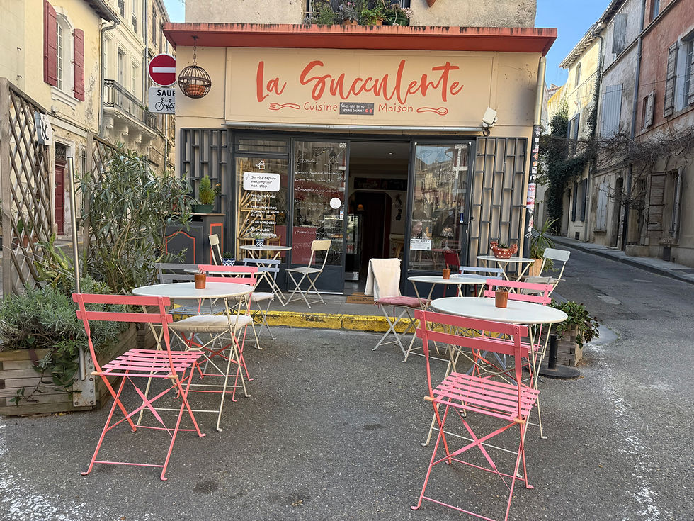 outdoor tables at a cafe in Arles, France