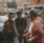 three men in jacket laughing at each other_edited.jpg