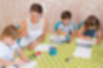 medium-shot-kids-painting-table.jpg