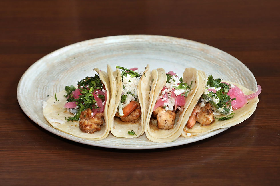 Authentic street tacos served at Chula’s Mexican-Latin Food & Spirits during Taco Tuesday in Prior Lake with fresh toppings and warm corn tortillas.