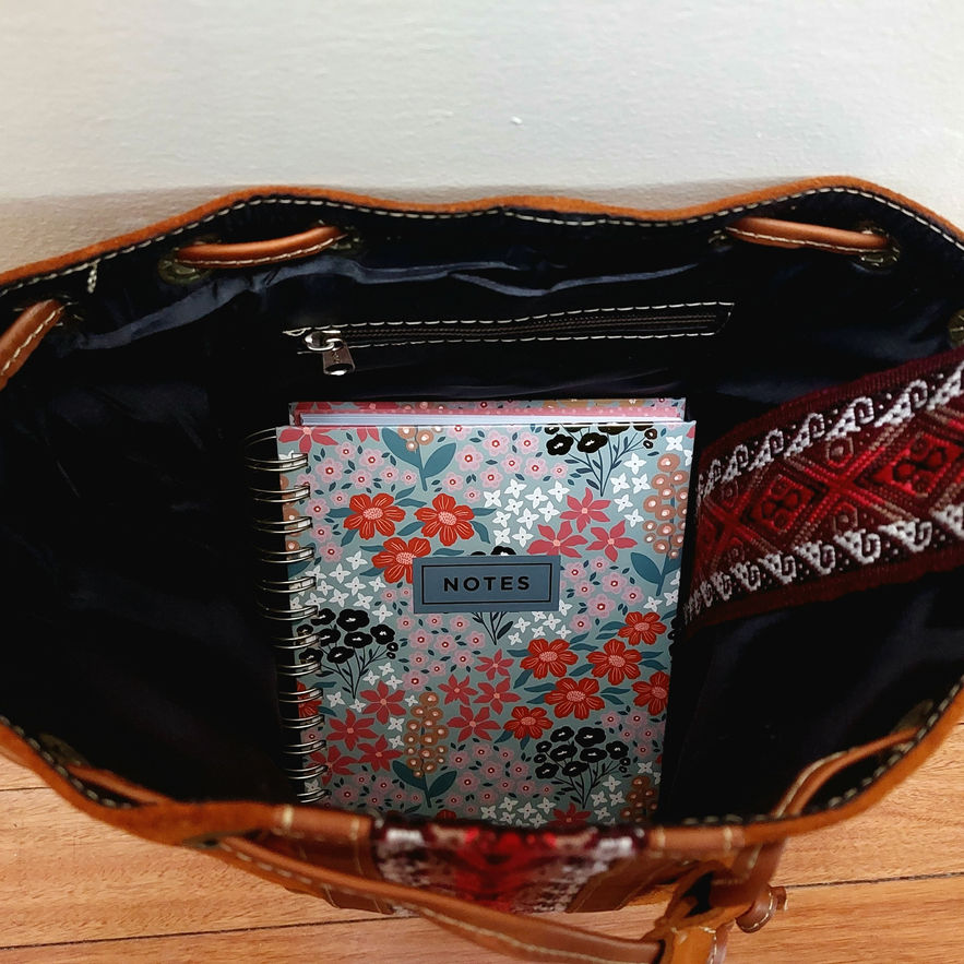 Brown leather bag with notebook and bracelet