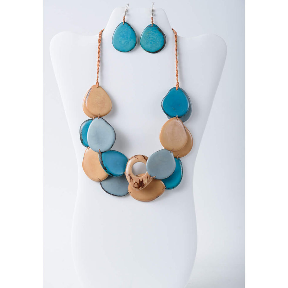 Layered tagua slice necklace in blue and beige tones, a unique handmade jewelry piece