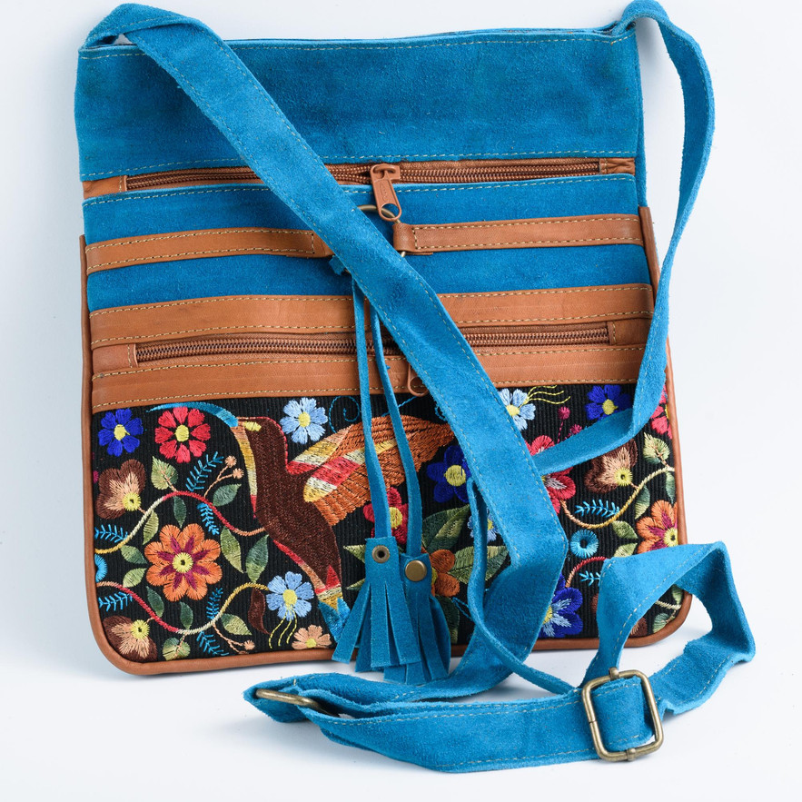 Embroidered crossbody bag with teal suede