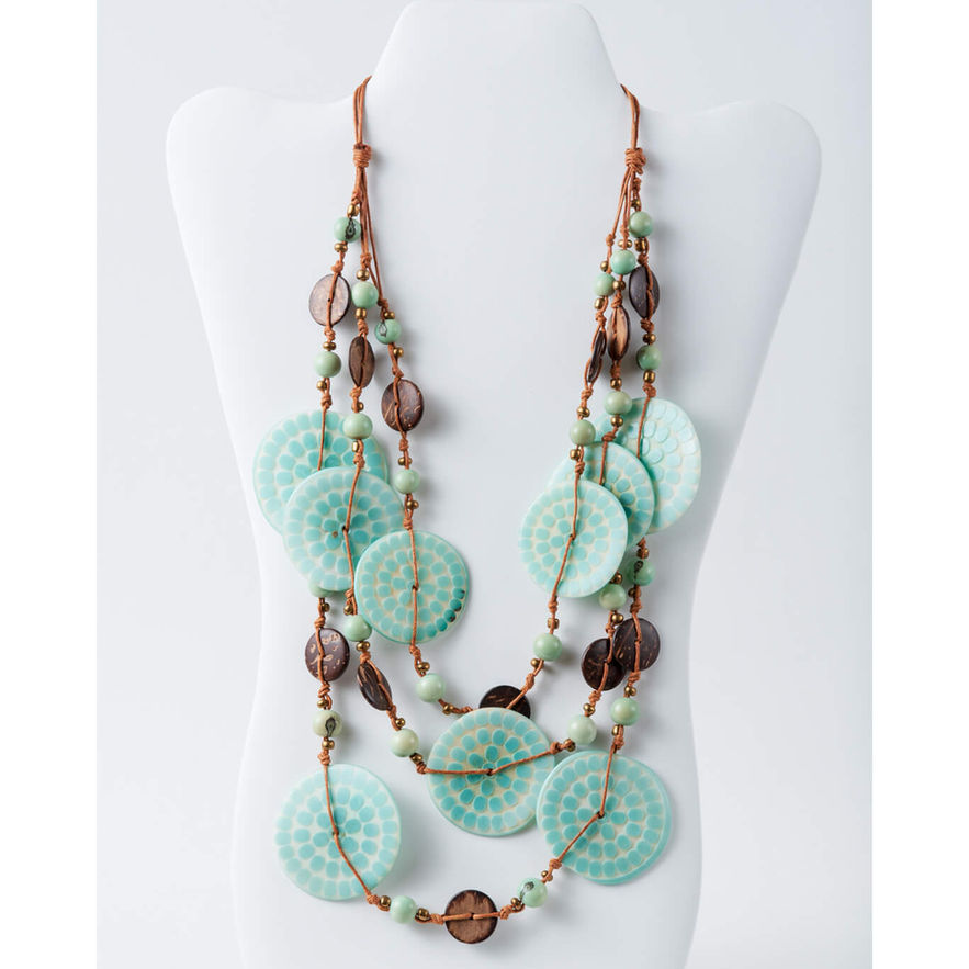 Turquoise necklace on display; Multistranded Acai & Coconut Necklace Turquoise polka dot with acai nuts and coconut buttons eleganty handcrafted, lightweight, organic fashion jewellry.