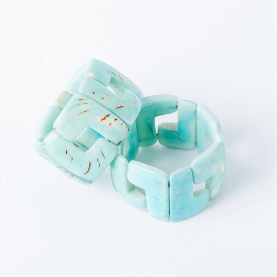 Pair of light blue carved tagua bracelets