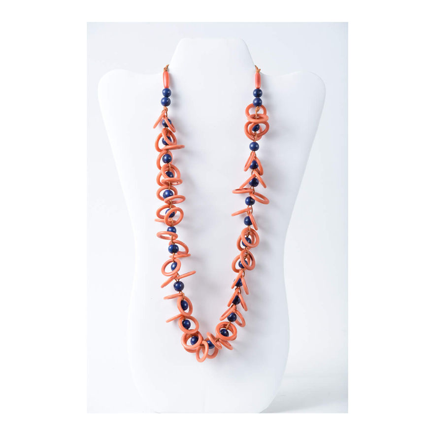 Orange necklace on display with blue beads, white background, elegant design made from tagua. handmade, organic and natural, lightweight. Fashion jewelry