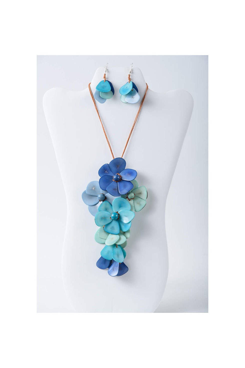 Blue multitoned Floral Blossom Tagua necklace and earrings set. Comfortable, adjustable lightweight, handcrafted, organic fashion jewelry