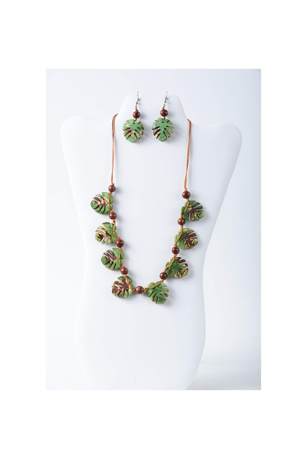 Handcrafted green tagua nut necklace and earring set. Monstera leaf design. Army camoflauge. lightweight, organic, natural and handmade, stylish and chic, beautiful but afordable, bold and flexible. Made with love by natue.