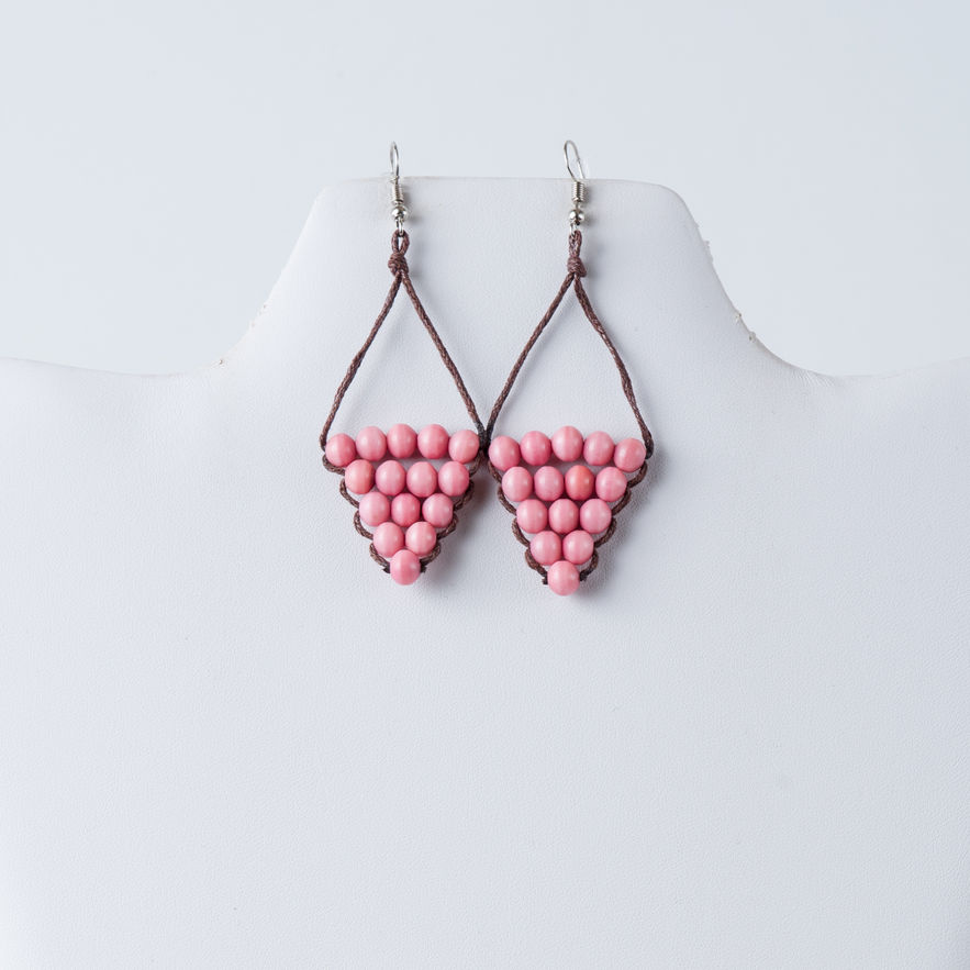 Pink tagua bead earrings on display; Nova Single-Color Tagua Bead Earrings – Handmade Triangle Earrings